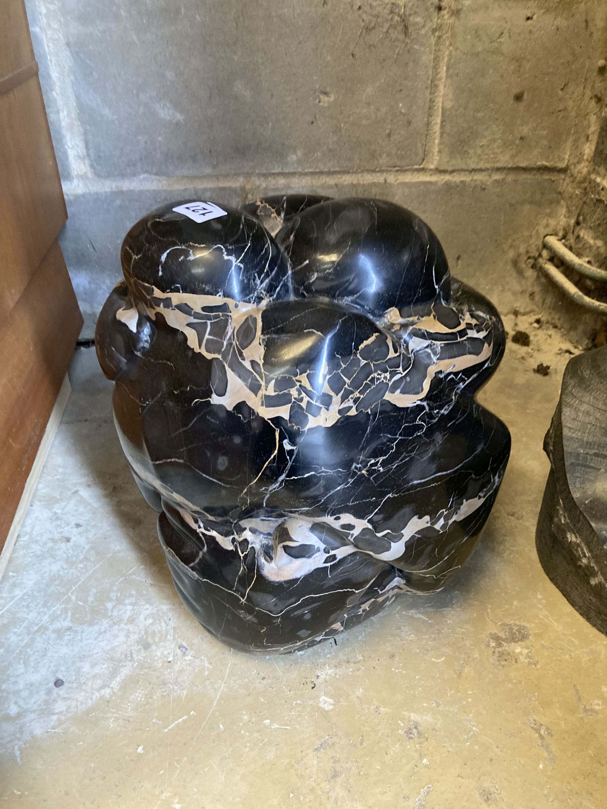 § Polly Ionides (born 1944), Love Knot, an abstract figural variegated black marble group, width 24cm, depth 24cm, height 35cm